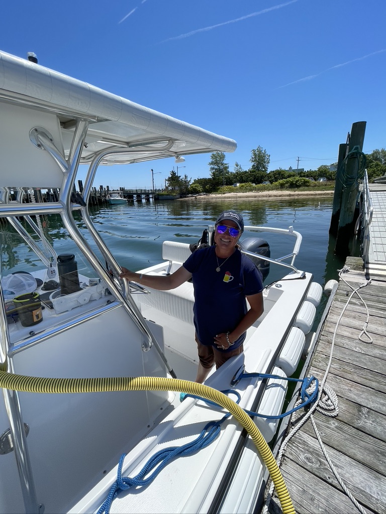East Hampton Town Trustees Pump-Out Boat and Captain Savannah Van Der Walt in Montauk harbor