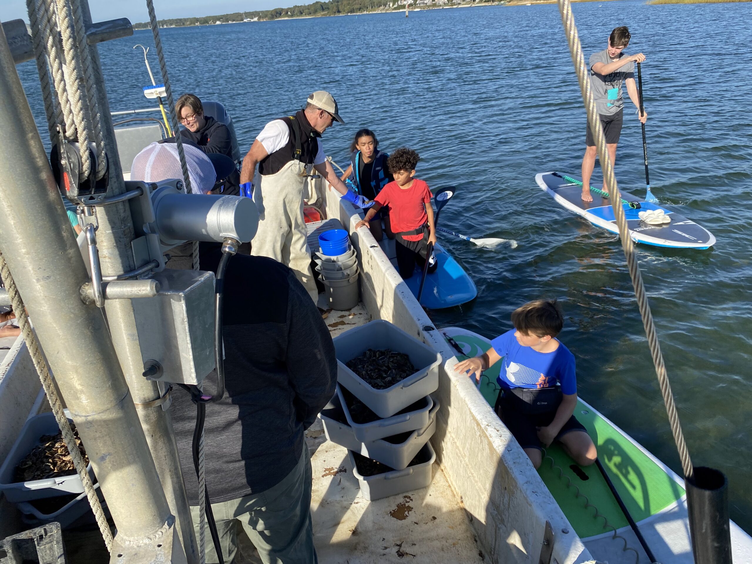 EH Middle School Students seed 3 Mile Harbor with oyster & clam seeds September 2022