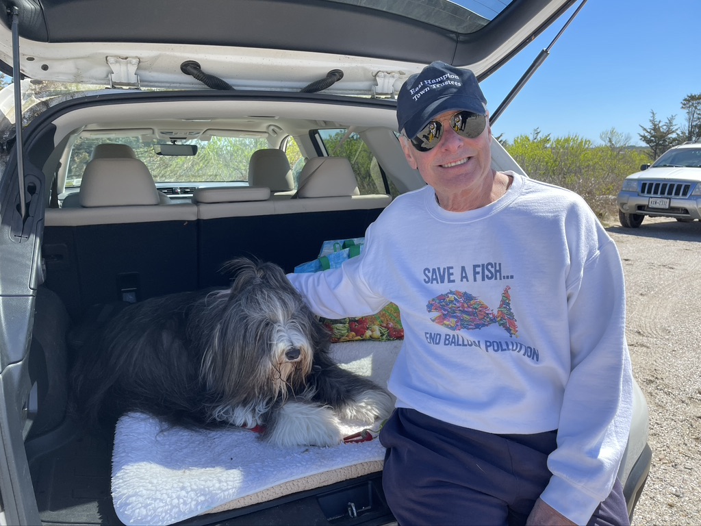 Paul Keber and Bearded Collie Kezar Love at beach clean up