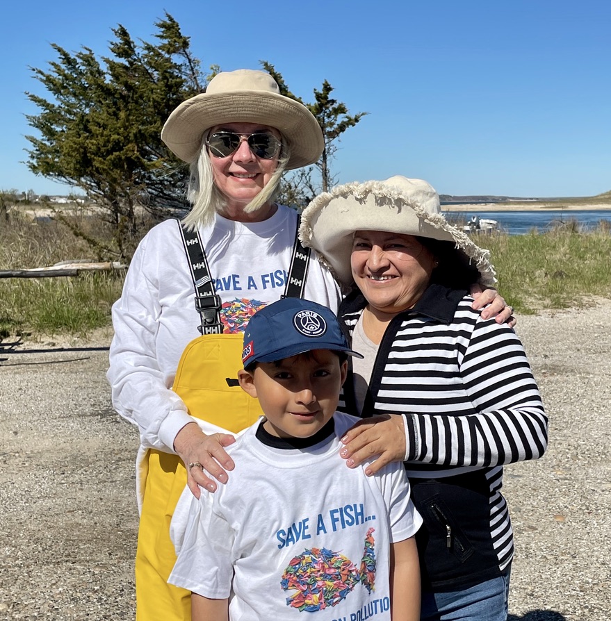Abraham, his mother, and Trustee Susan McGraw-Keber beach cleanup at Lazy Point