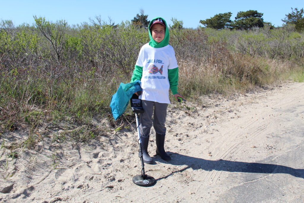 Student beach clean up participant at Lazy Point boat ramp