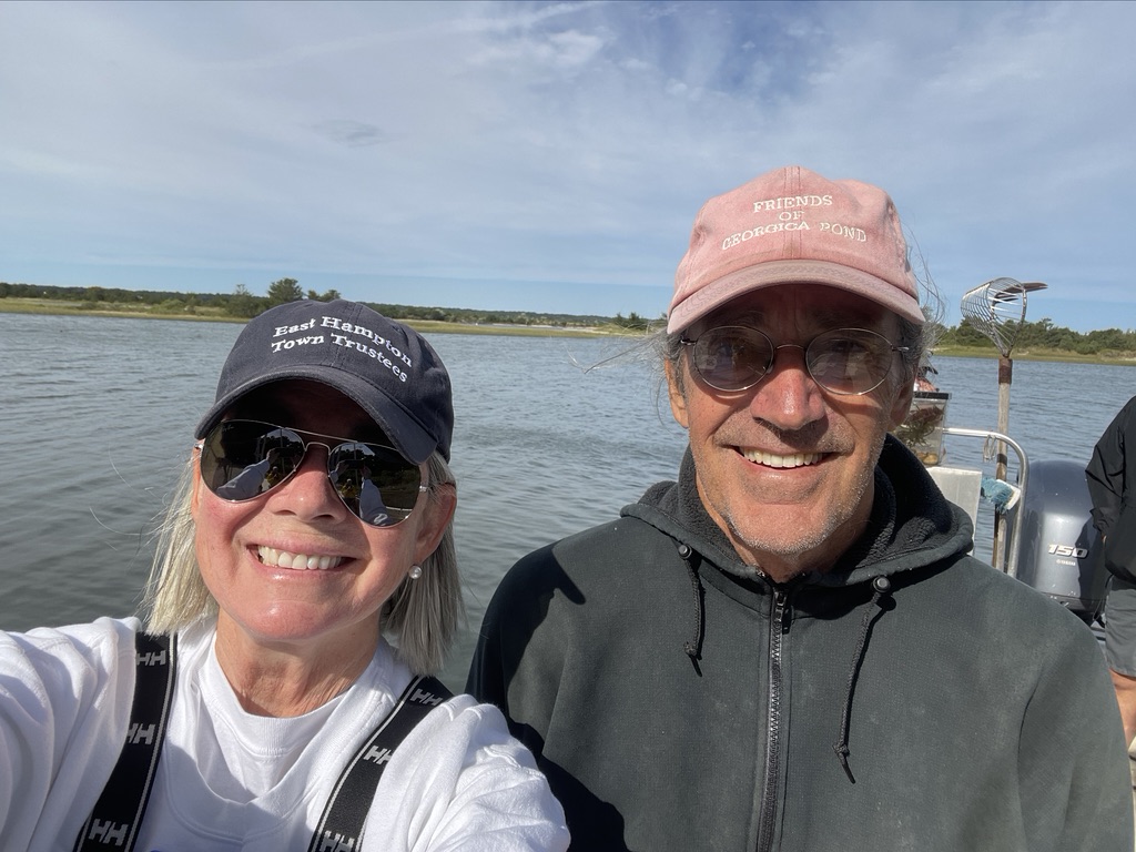 Trustees Susan McGraw-Keber & John Aldred to help seeding Three Mile Harbor with oyster and clam seeds.