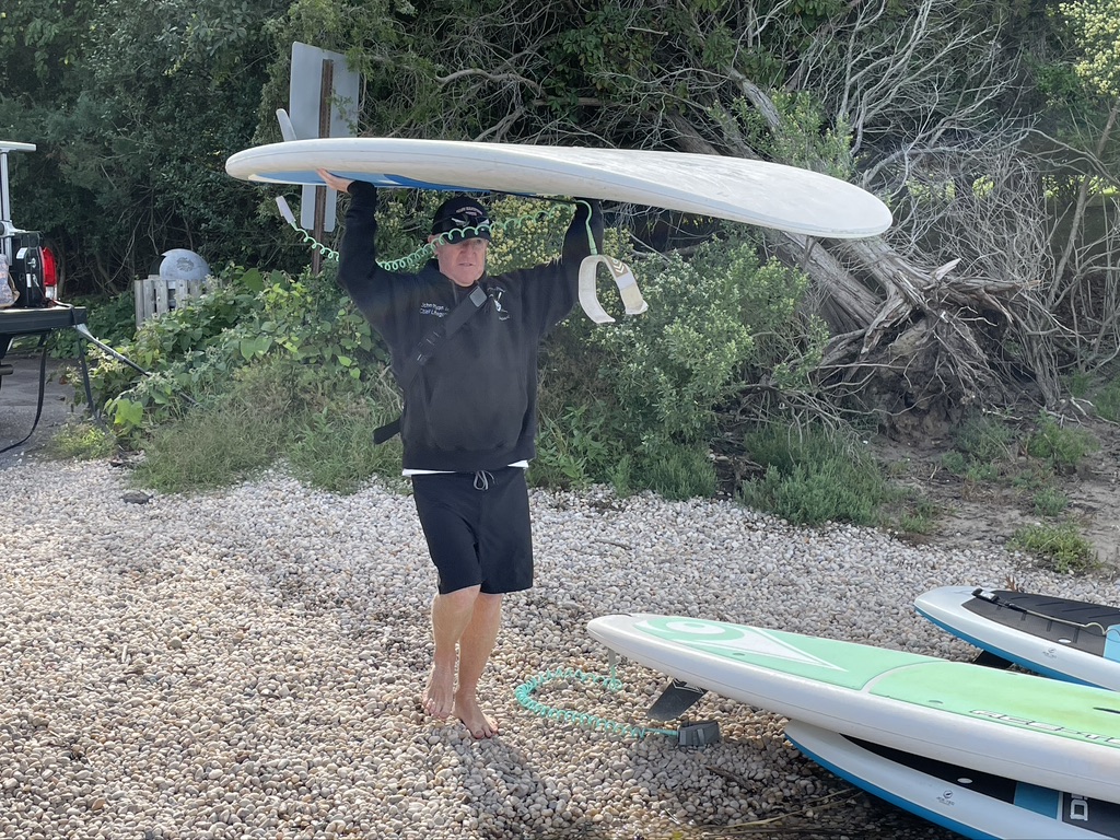 EH Ocean Rescue's John Ryan Jr. with paddle board