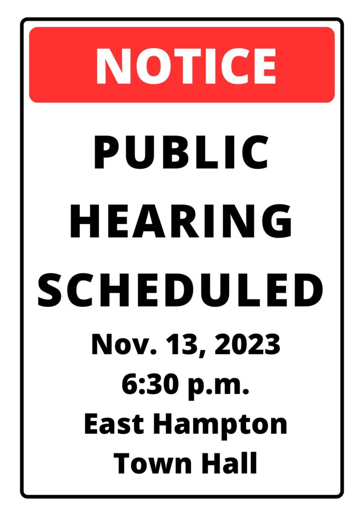 Image of a white and red sign reading, "Notice. Public Hearing Scheduled. Nov. 13, 2023 East Hampton Town Hall