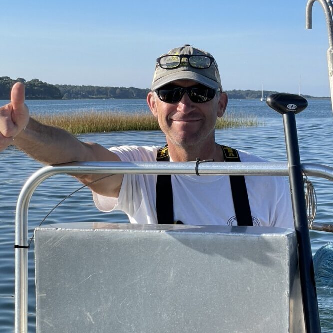 John "Barley" Dunne , Director of the East Hampton Shellfish Hatchery - Seeding on Three Mile Harbor with the students of EH Middle School 2023