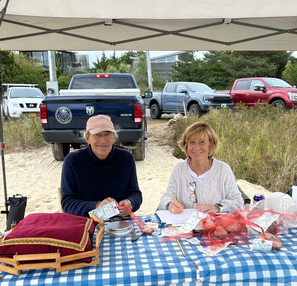 John Aldred & Kim Shaw at the weighing and size measuring station of the clams