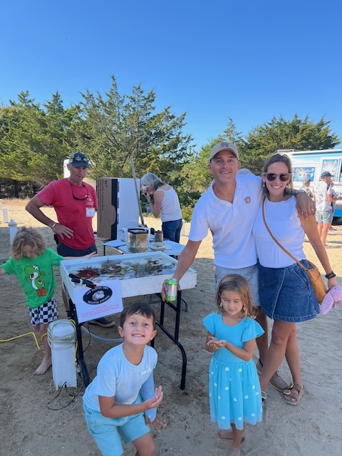 Trustee David Cataletto with his wife Elizabeth and two children. John "Barley" Dunne, Director of the EH Shellfish Hatchery with LIVE marine species from our local waters.